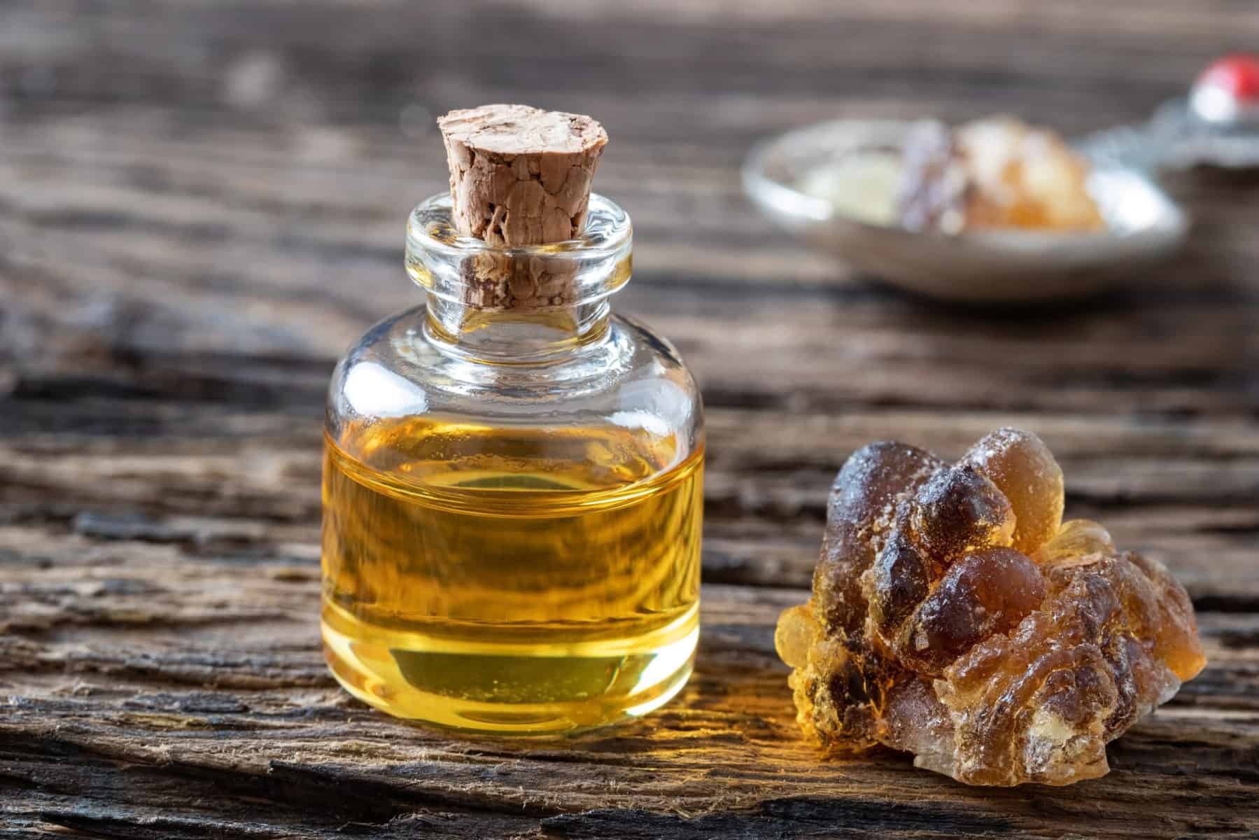 A bottle of essential oil with frankincense resin